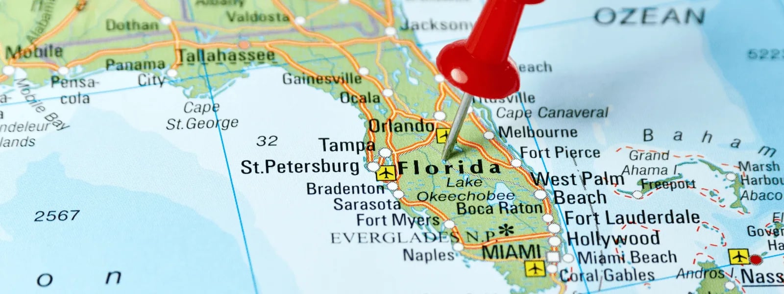 Red pin on a map pointing to orlando, florida, with nearby cities like tampa and miami also visible. 