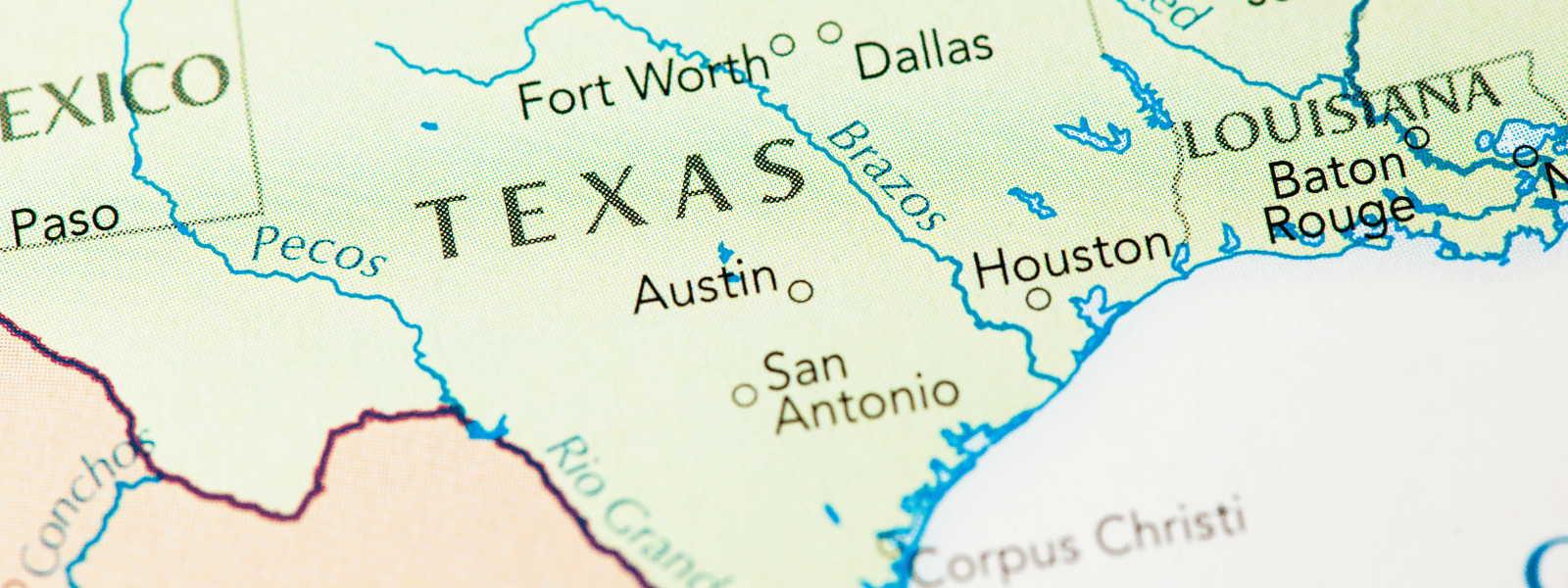 Close-up of a map showing texas and its major cities such as dallas, austin, and houston, as well as parts of surrounding states. 